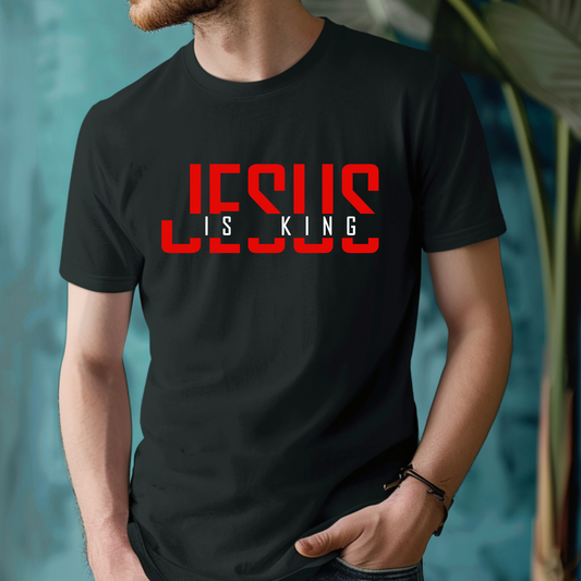 Person wearing a black t-shirt with 'Jesus is King' text in red and white.