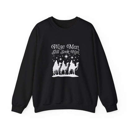 Black sweatshirt with 'Wise Men Still Seek Him' text and nativity scene graphic on a white background