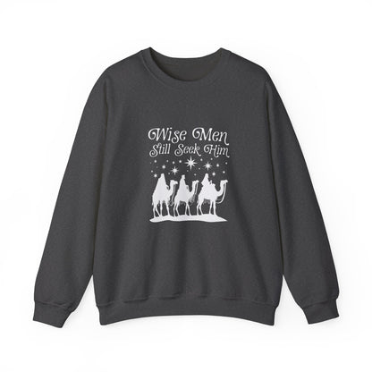 Dark gray sweatshirt with 'Wise Men Still Seek Him' text and nativity scene graphic on a white background